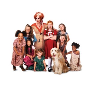 ANNIE - Lesley Joseph as Miss Hannigan with Annie and orphans. Photo credit Matt Crockett