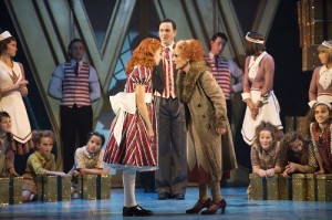 ANNIE - The Company and Lesley Joseph as 'Miss Hannigan'. Photo credit Paul Coltas