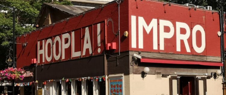 3 Grown Ups Sitting Around a Table | Hoopla Improv Theatre | Review
